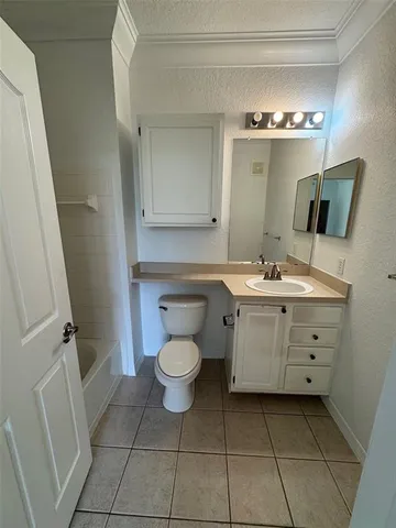 a bathroom with a sink toilet and mirror