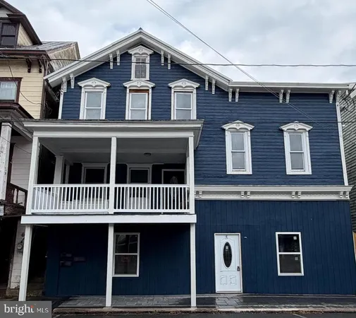 a front view of a house with a garage