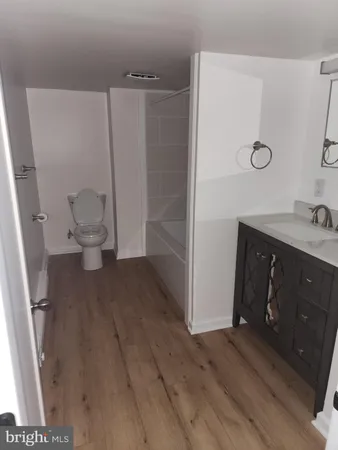 a view of an empty room with wooden walls