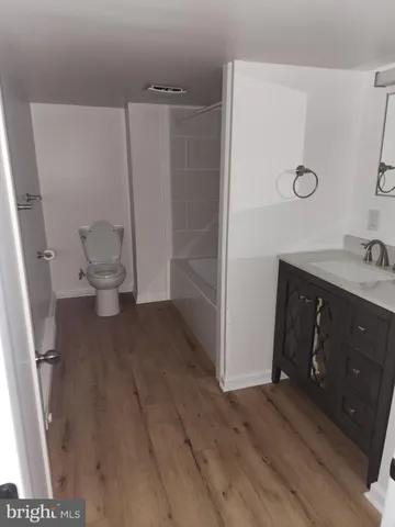 a view of an empty room with wooden walls