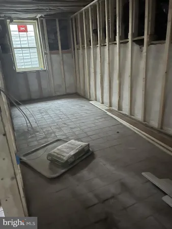 a view of a room with wooden stairs