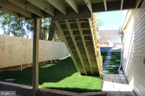 a view of backyard with green space