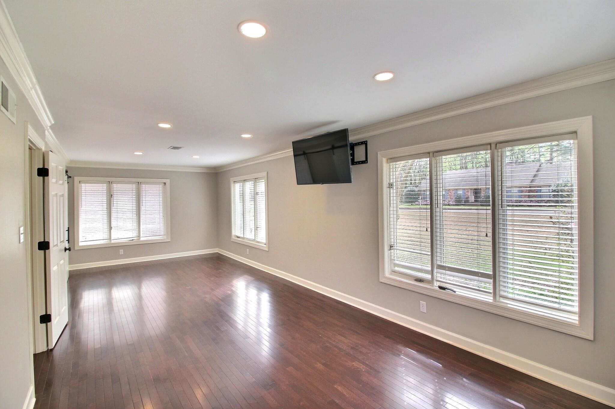 7572 Willey Road Germantown, TN 38138 - Photo 13 of 30 a view of an empty room with wooden floor and a window