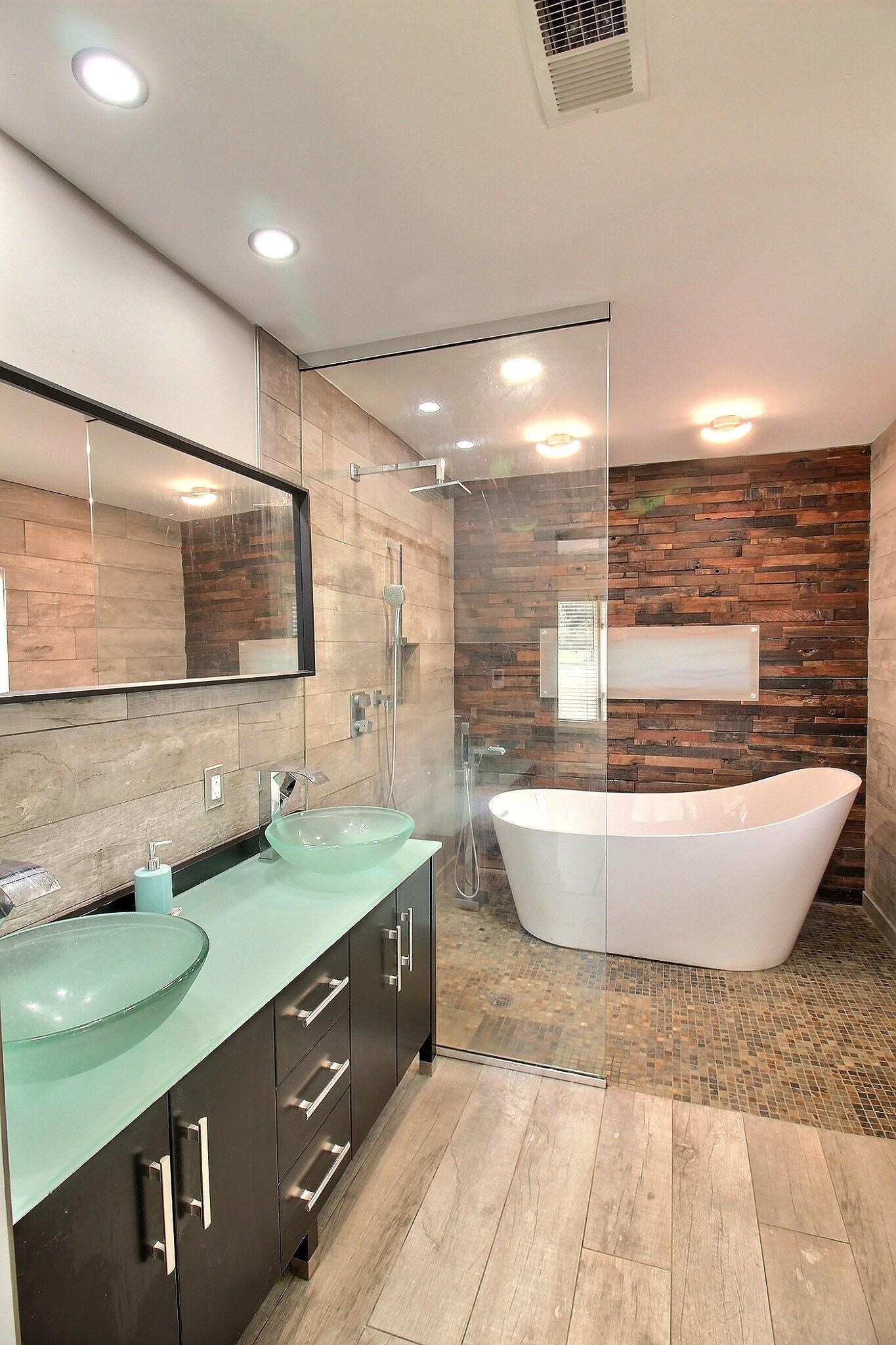 7572 Willey Road Germantown, TN 38138 - Photo 16 of 30 a spacious bathroom with a double vanity sink a mirror and a bathtub