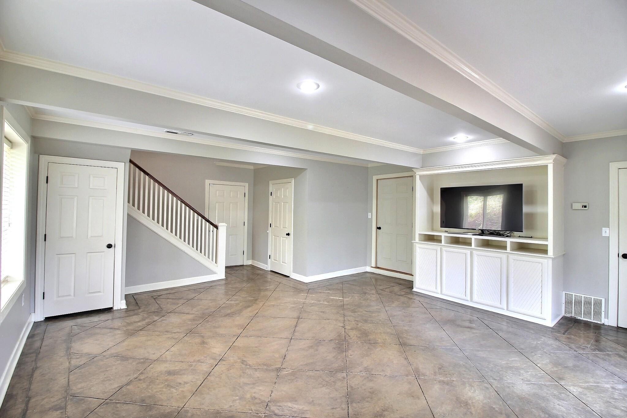 7572 Willey Road Germantown, TN 38138 - Photo 18 of 30 a view of an empty room with a kitchen and a window