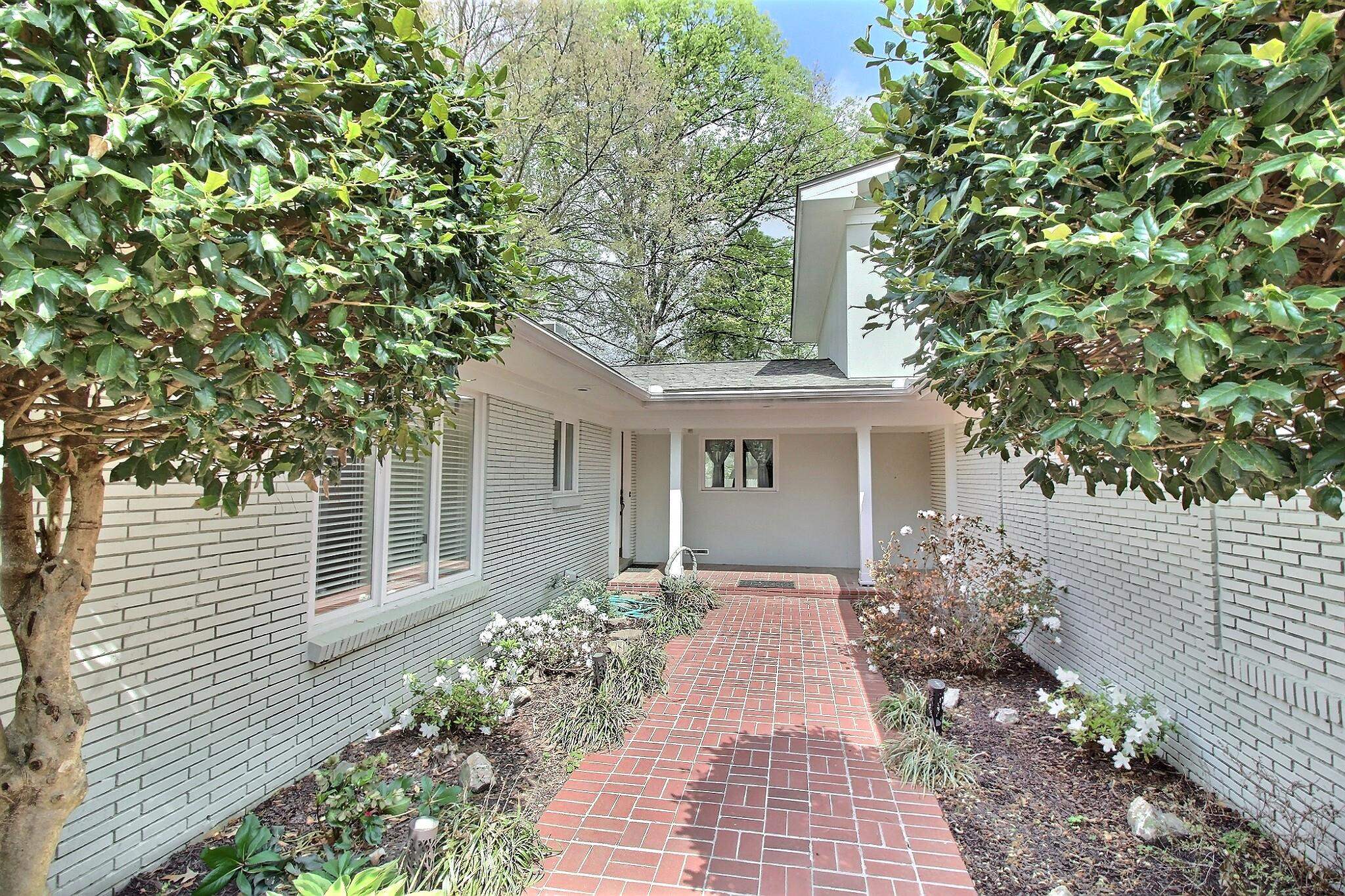 7572 Willey Road Germantown, TN 38138 - Photo 2 of 30 a front view of a house with garden