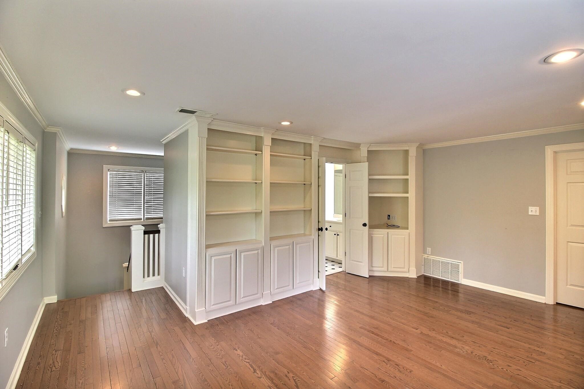 7572 Willey Road Germantown, TN 38138 - Photo 23 of 30 an empty room with wooden floor closet and windows