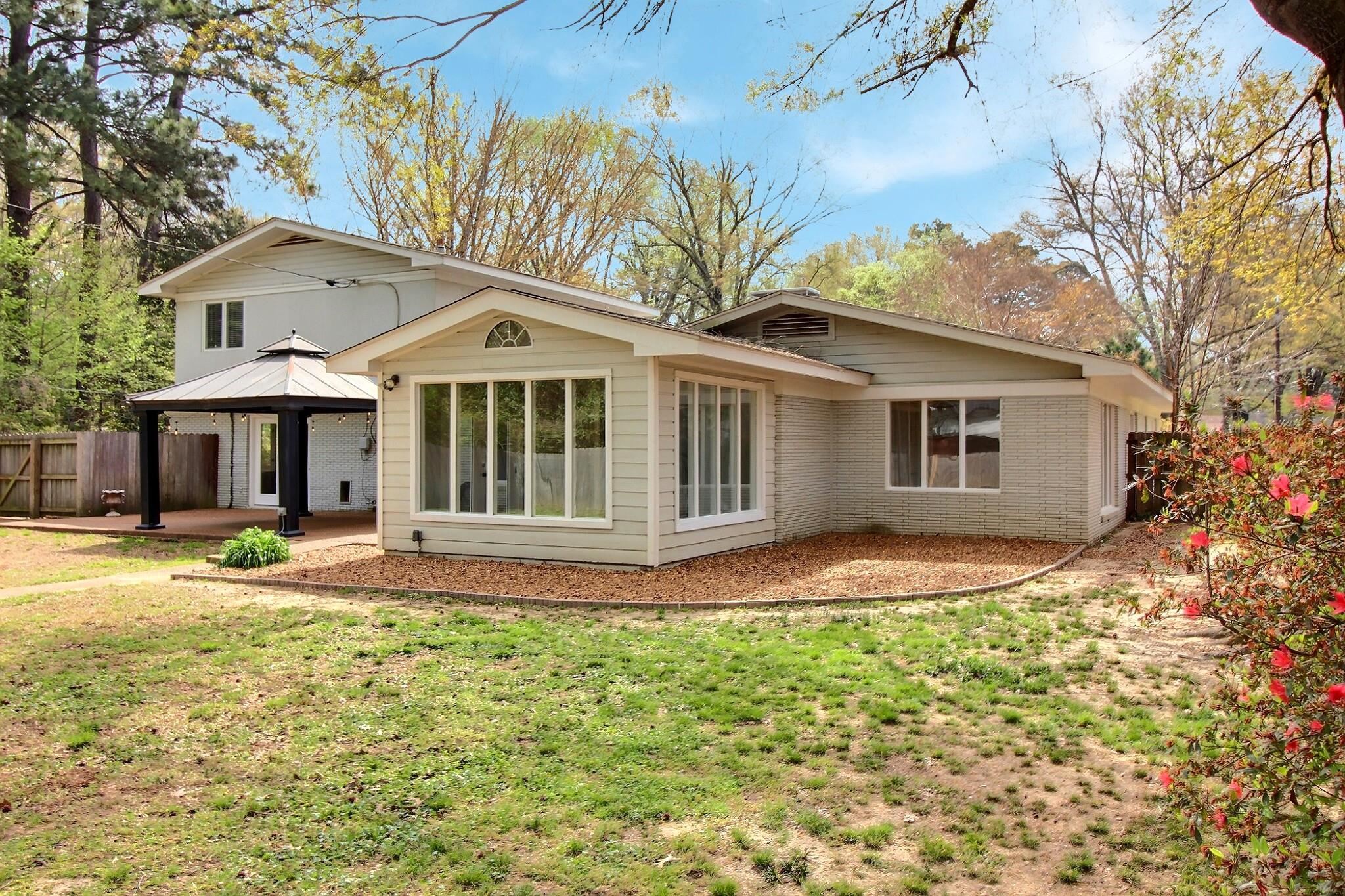 7572 Willey Road Germantown, TN 38138 - Photo 28 of 30 a front view of a house with a garden and yard