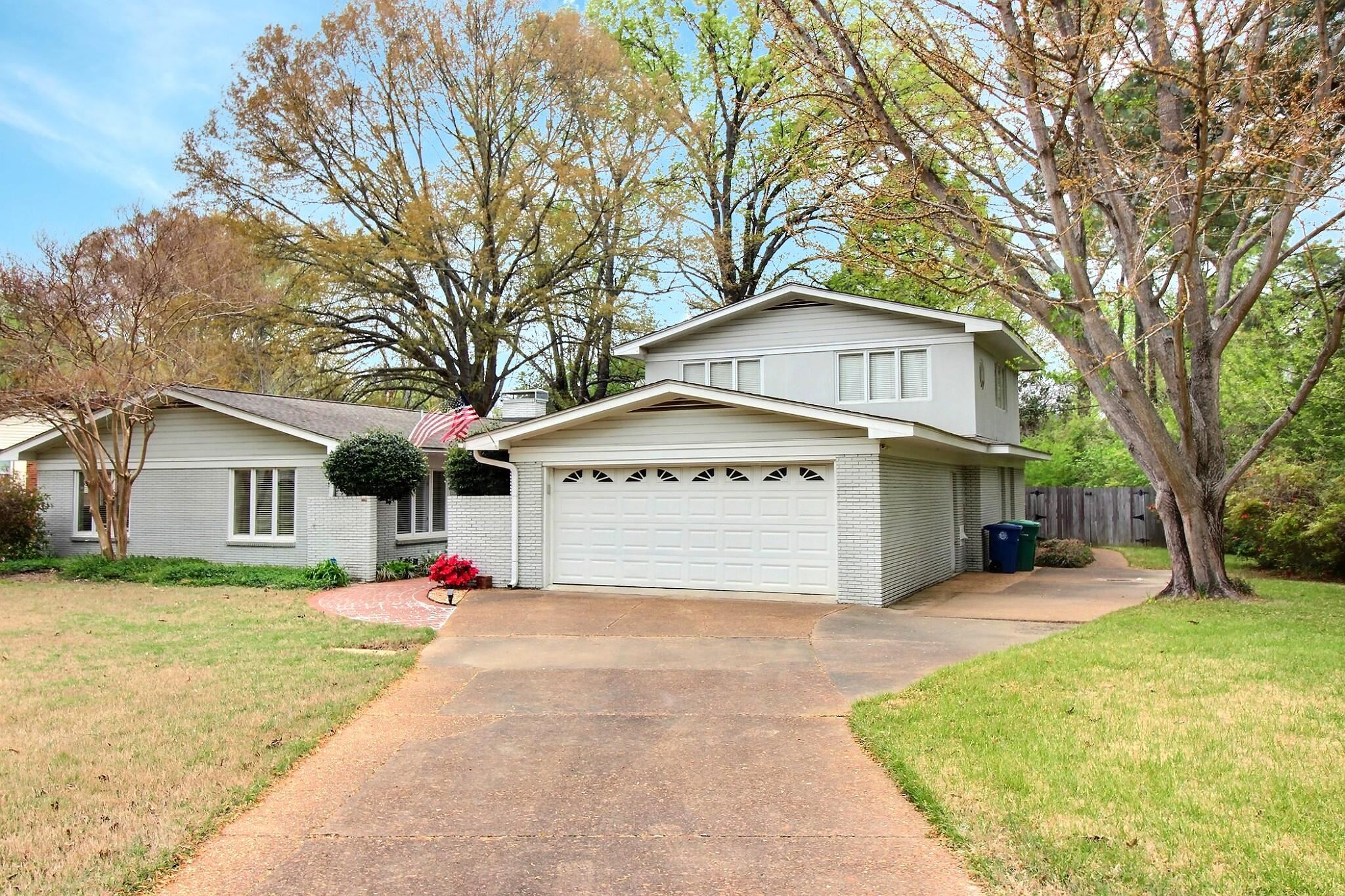 7572 Willey Road Germantown, TN 38138 - Photo 30 of 30 a front view of a house with a yard and garage