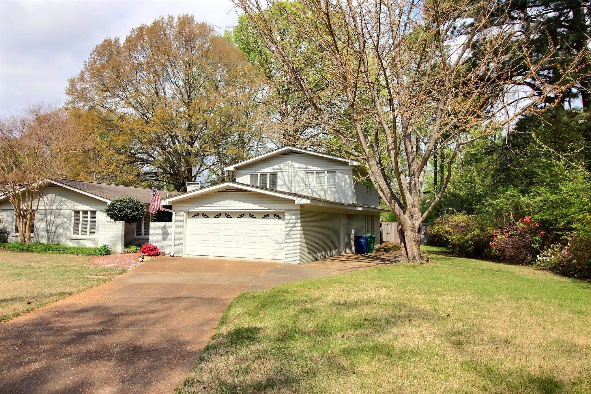 7572 Willey Road Germantown, TN 38138 - Photo 3 of 30 a front view of a house with a yard and garage