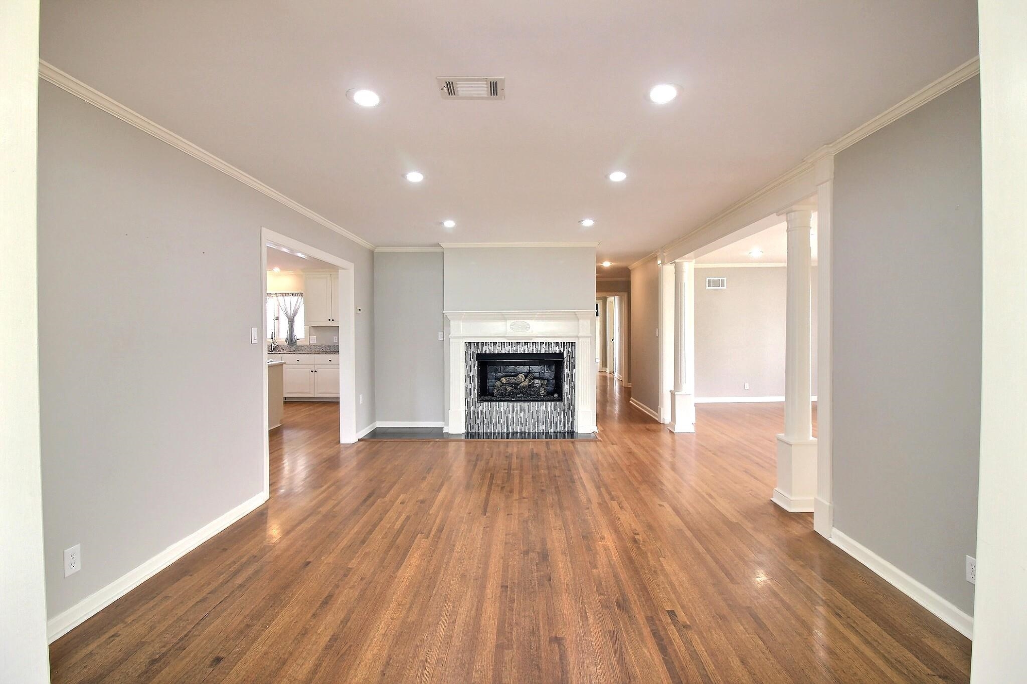 7572 Willey Road Germantown, TN 38138 - Photo 4 of 30 a view of a room with wooden floor fireplace and windows