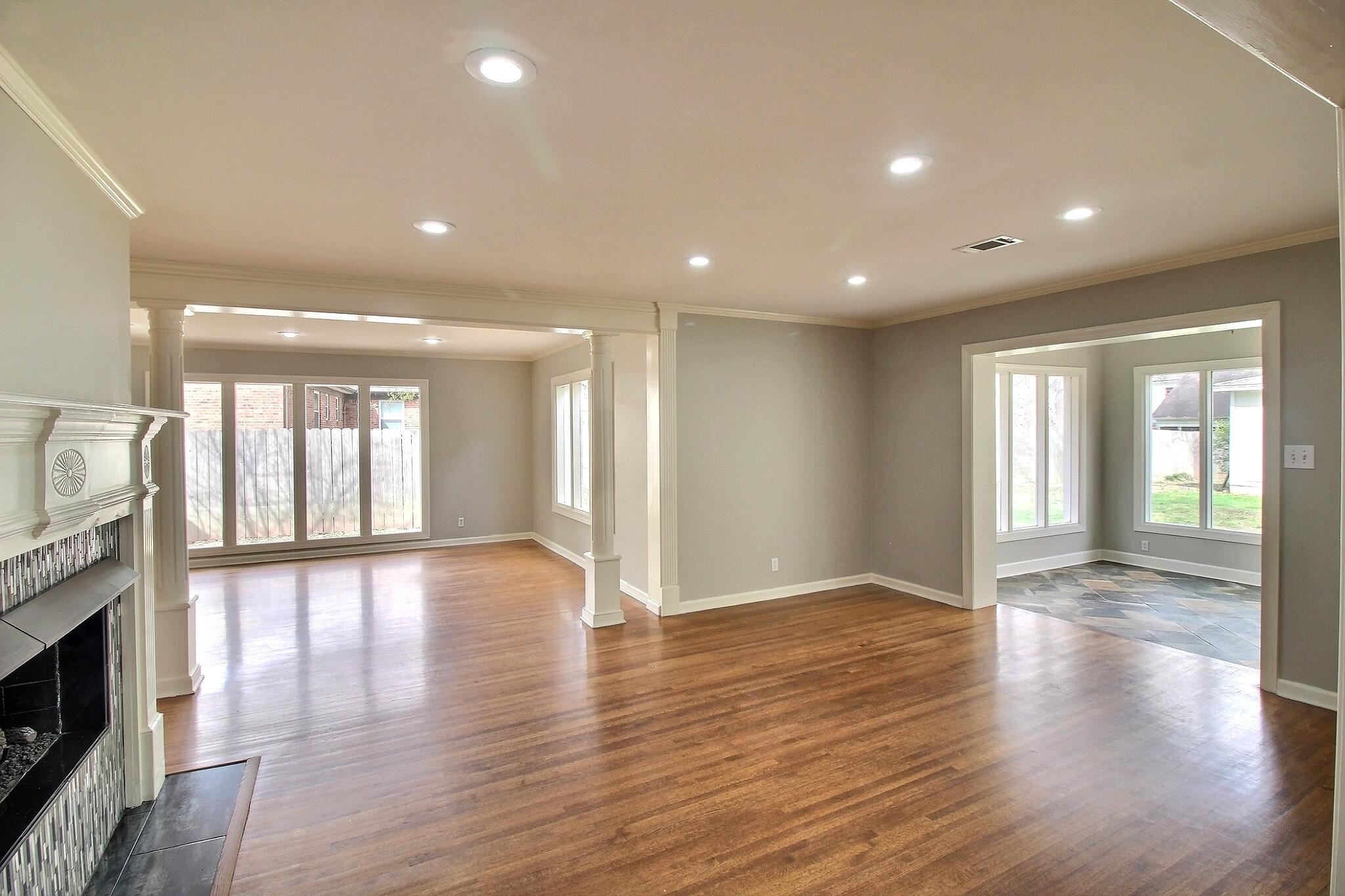 7572 Willey Road Germantown, TN 38138 - Photo 6 of 30 a view of an empty room with wooden floor and a fireplace