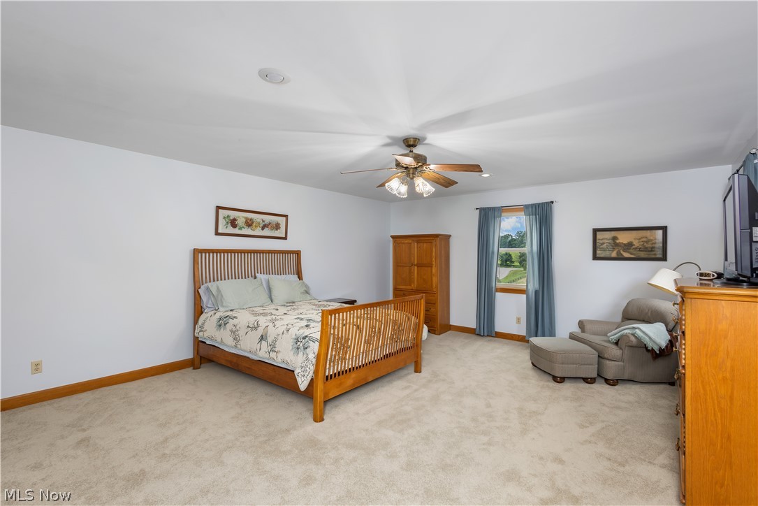 10909 Ruby Road Cambridge, OH 43725 - Photo 19 of 34 Bedroom featuring light colored carpet and ceiling fan
