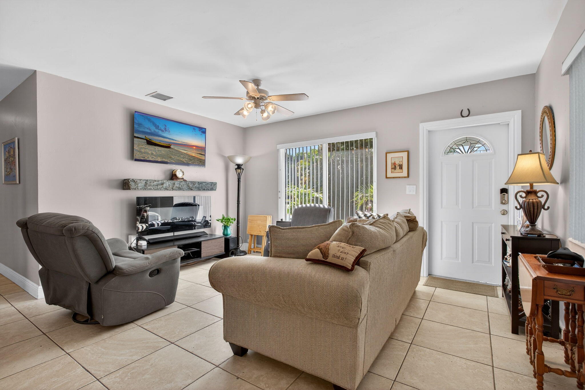 425 Southwest 10th Street Pompano Beach, FL 33060 - Photo 12 of 47 a living room with furniture a ceiling fan and a window