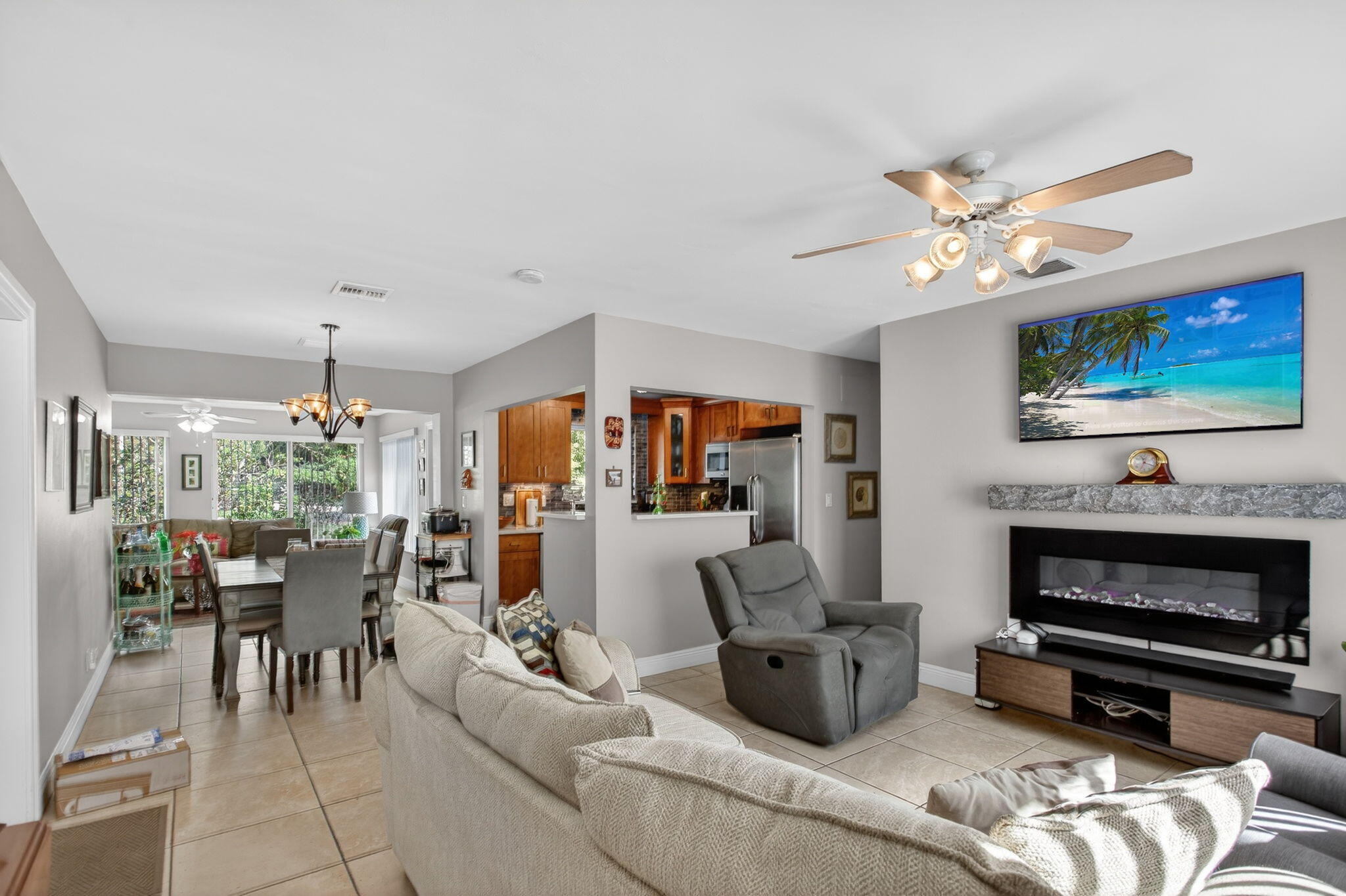 425 Southwest 10th Street Pompano Beach, FL 33060 - Photo 15 of 47 a living room with furniture and a flat screen tv