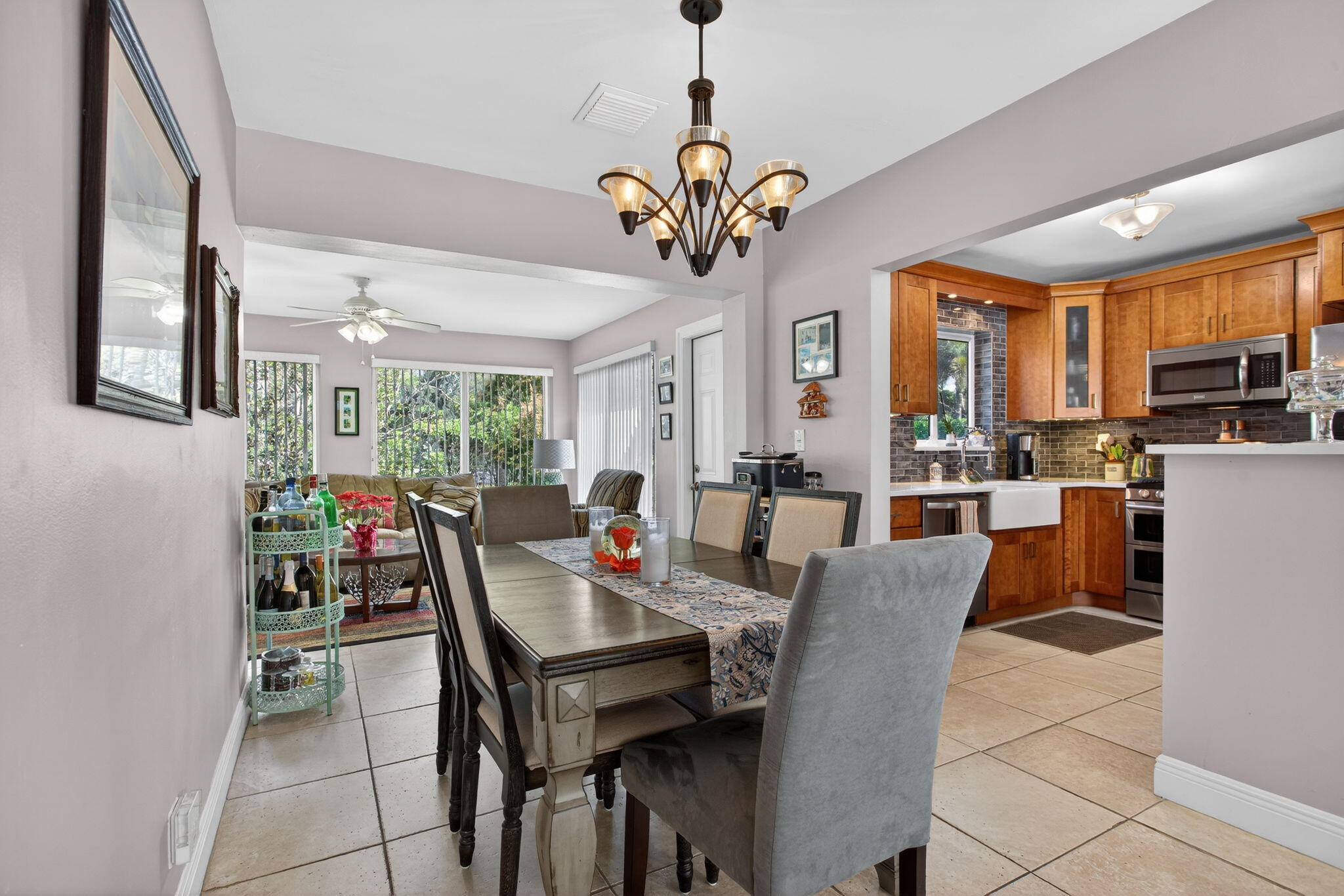 425 Southwest 10th Street Pompano Beach, FL 33060 - Photo 16 of 47 a view of a dining room with furniture window and wooden floor