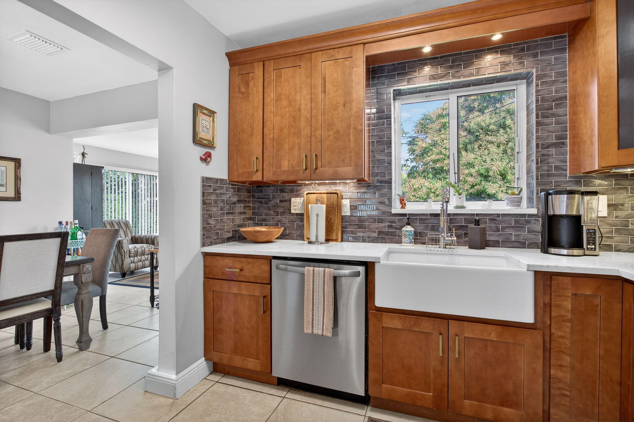 425 Southwest 10th Street Pompano Beach, FL 33060 - Photo 25 of 47 a kitchen with stainless steel appliances a sink stove and a refrigerator