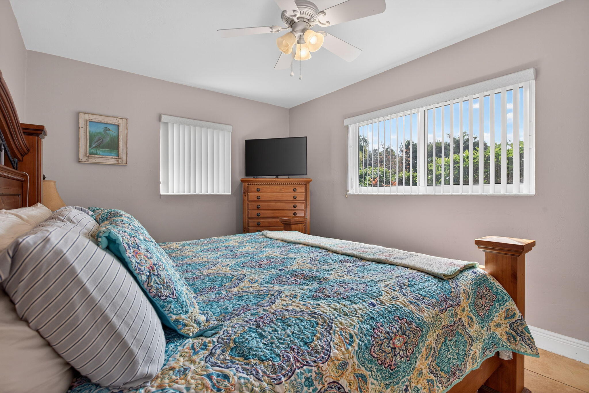 425 Southwest 10th Street Pompano Beach, FL 33060 - Photo 29 of 47 a bedroom with a bed and a chandelier