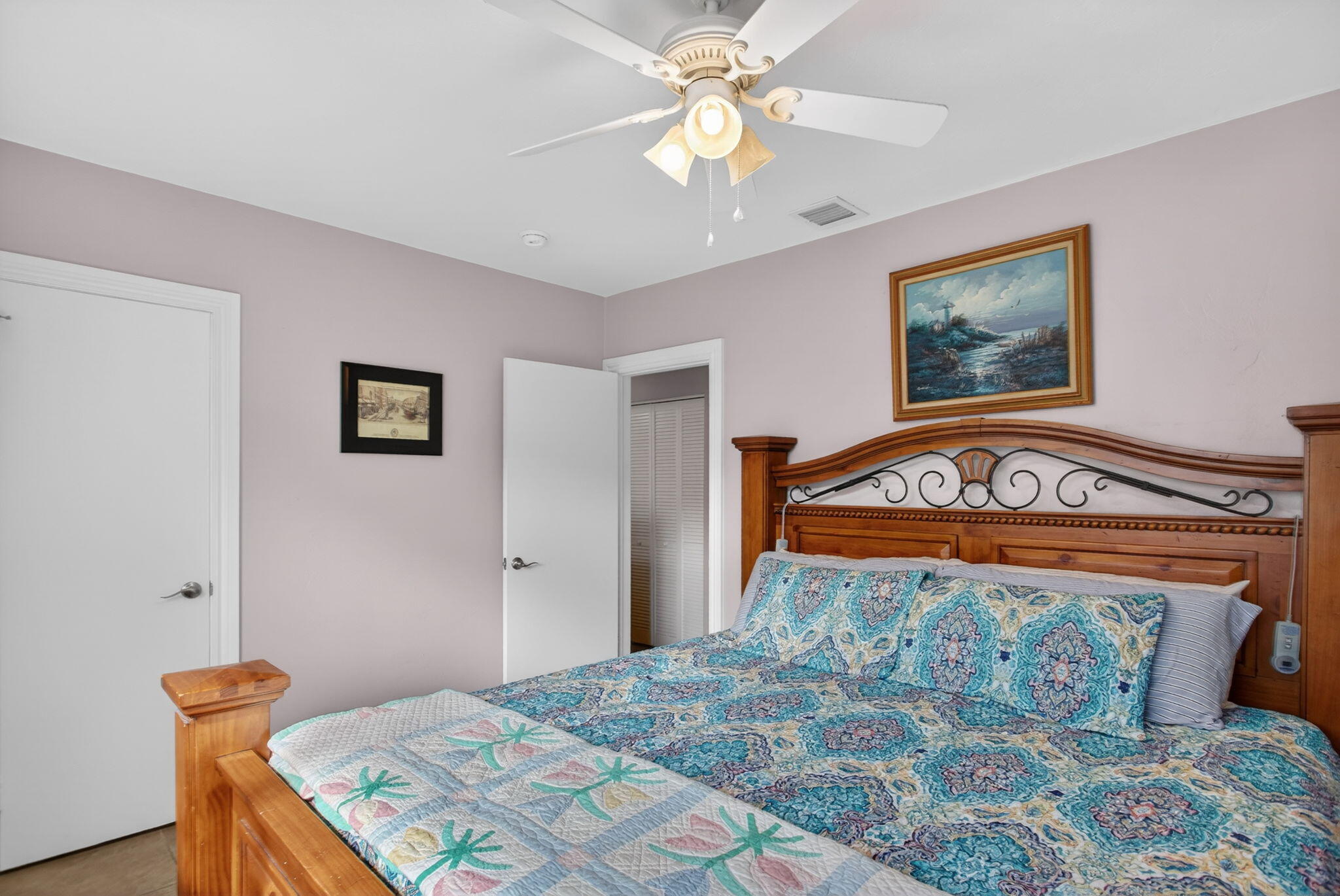 425 Southwest 10th Street Pompano Beach, FL 33060 - Photo 30 of 47 a bedroom with a bed and a chandelier