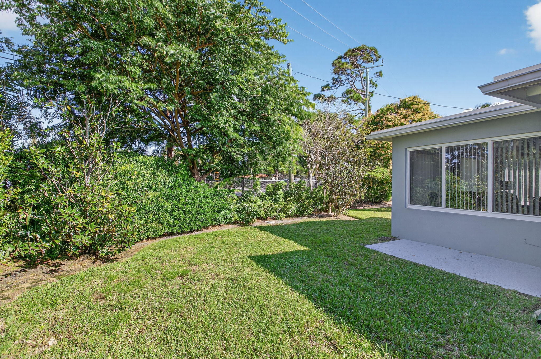 425 Southwest 10th Street Pompano Beach, FL 33060 - Photo 7 of 47 a view of a backyard with plants and large tree