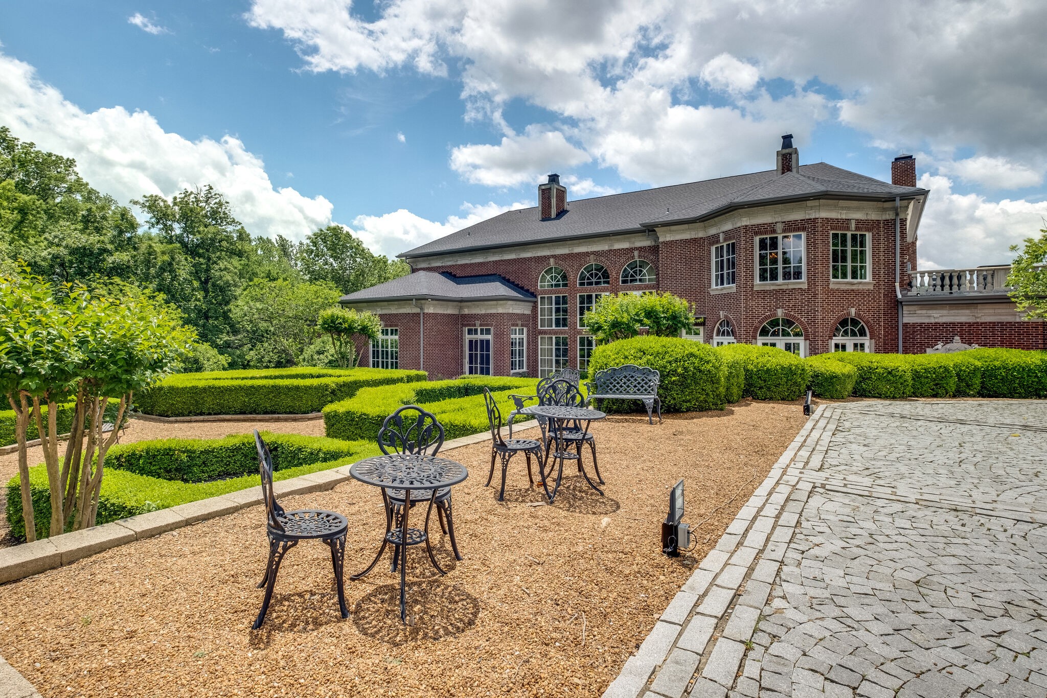 9600 Concord Road Brentwood, TN 37027 - Photo 72 of 99 a view of a house with backyard sitting area and garden