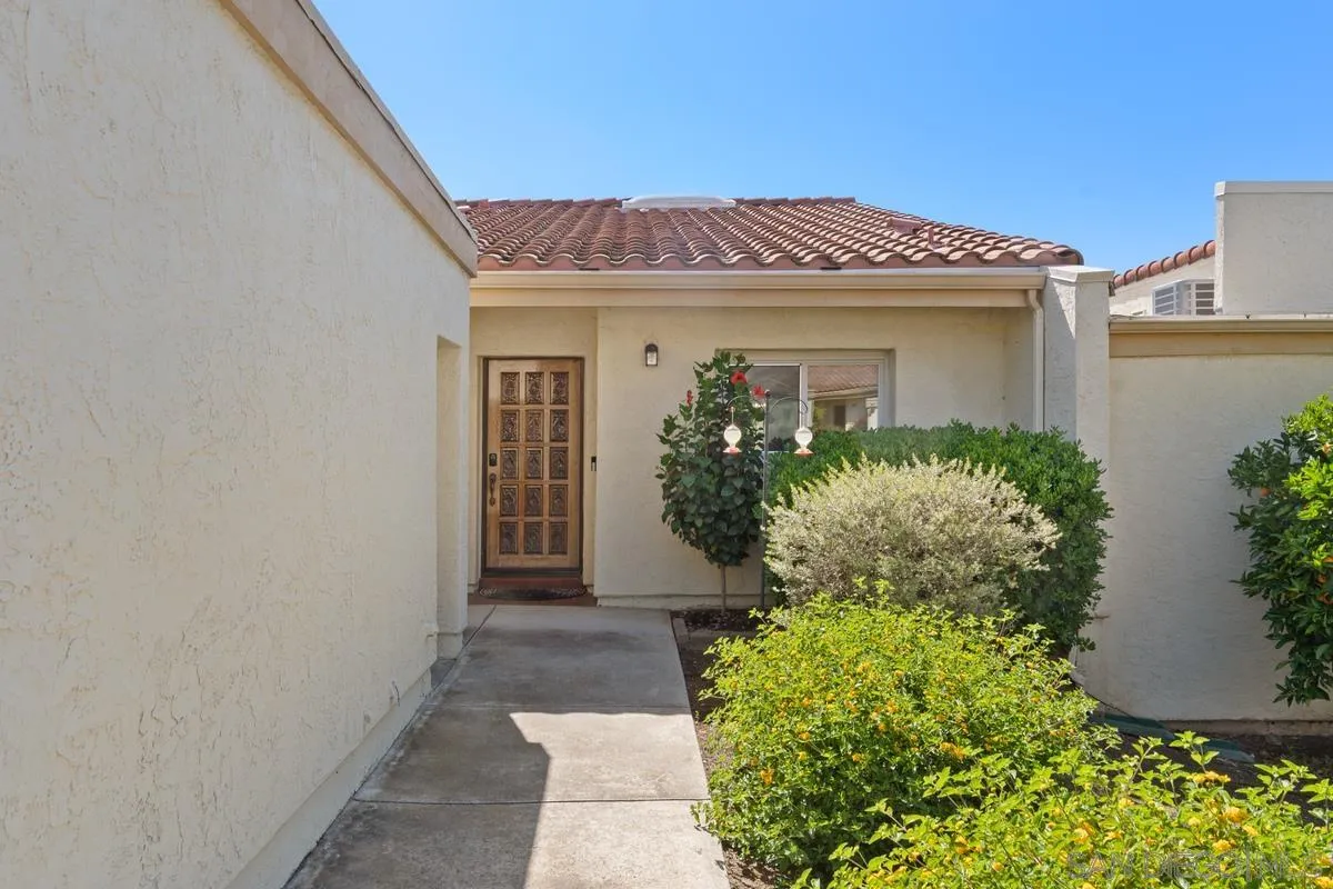 17442 Port Marnock Drive Poway, CA 92064 - Photo 3 of 28 a view of a house with potted plants