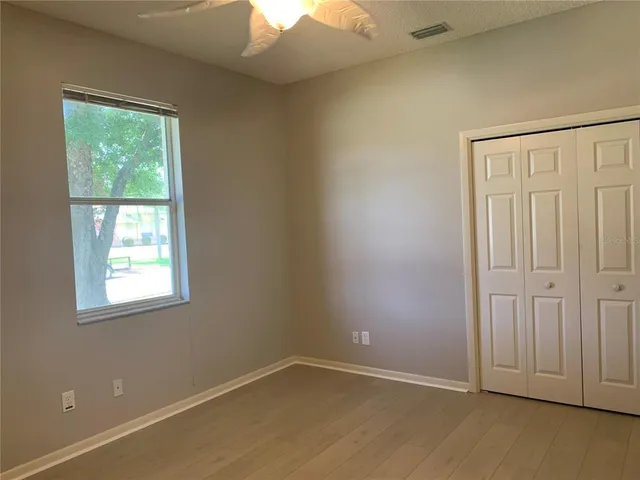 a view of a backyard with sitting area
