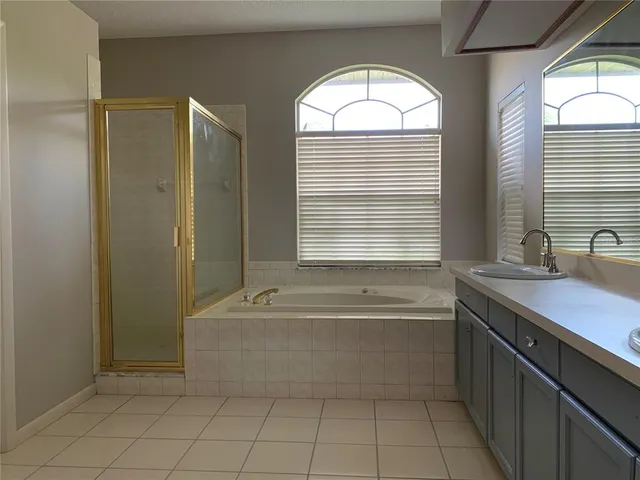 a bathroom with a bathtub and a sink