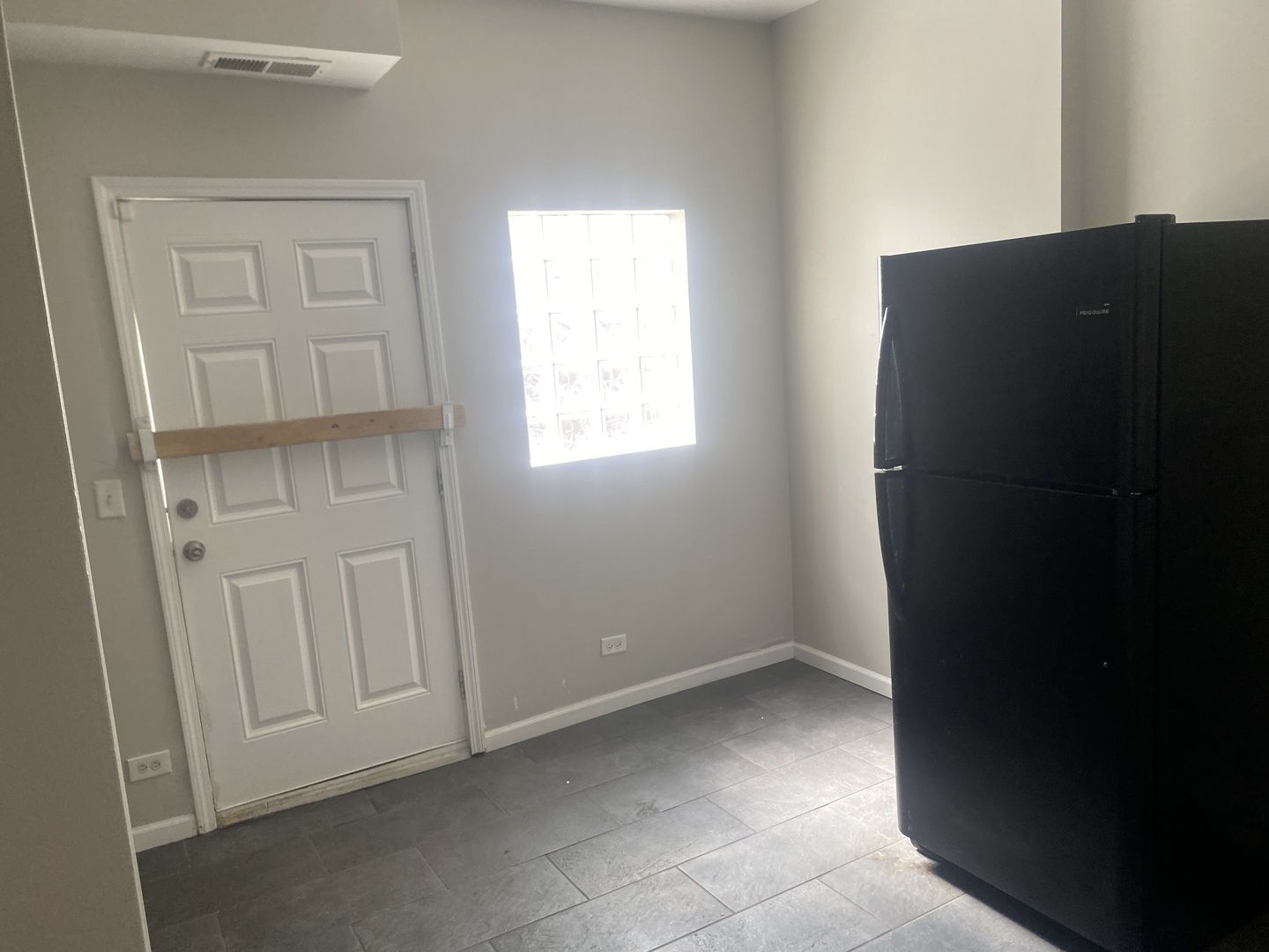 1253 West 80th Street, Unit 2E Chicago, IL 60620 - Photo 6 of 10 an empty room with windows