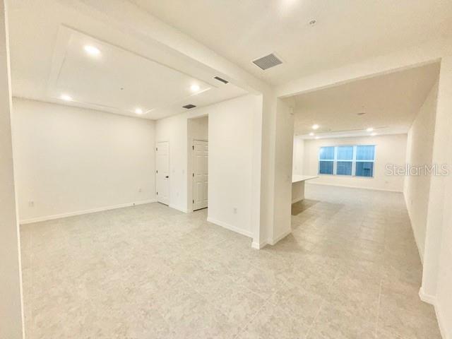 1463 Alston Bay Boulevard Apopka, FL 32703 - Photo 3 of 19 an empty room with entrance and windows