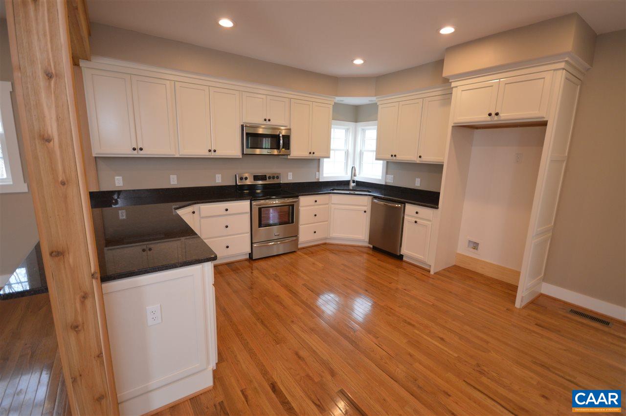 2501 Dunnes Shop Road Ruckersville, VA 22968 - Photo 12 of 46 a kitchen with stainless steel appliances granite countertop a refrigerator a stove top oven a sink and dishwasher with wooden floor