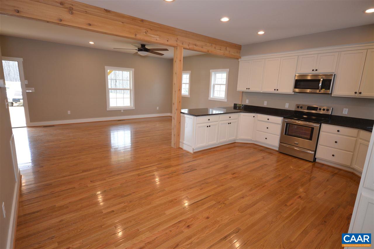2501 Dunnes Shop Road Ruckersville, VA 22968 - Photo 13 of 46 a large kitchen with stainless steel appliances granite countertop a stove a sink and white cabinets