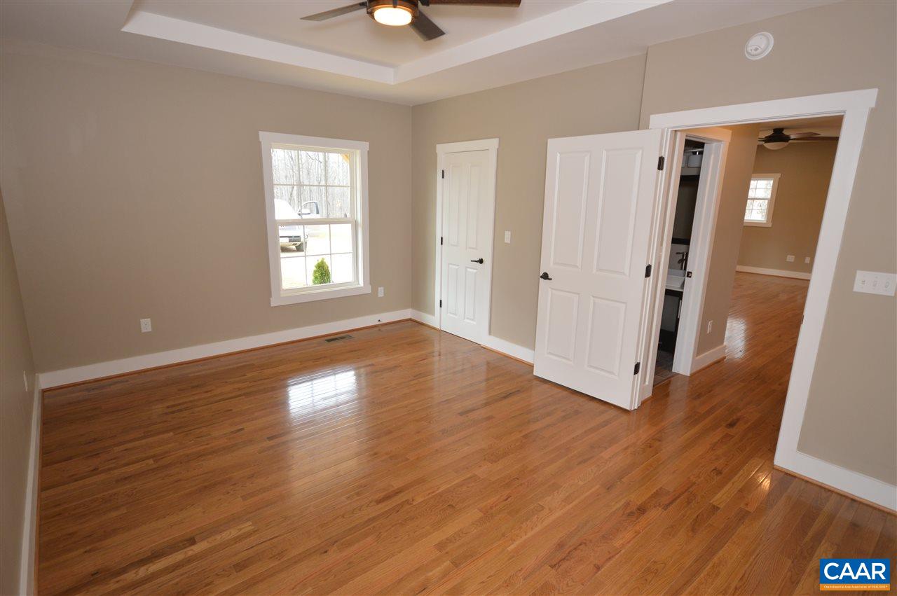 2501 Dunnes Shop Road Ruckersville, VA 22968 - Photo 15 of 46 an empty room with wooden floor and windows