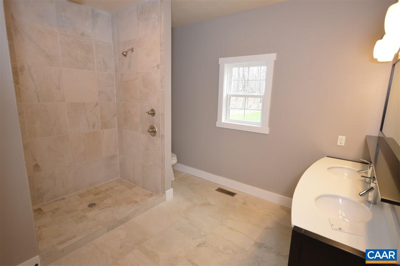 2501 Dunnes Shop Road Ruckersville, VA 22968 - Photo 17 of 46 a bathroom with a sink toilet and shower