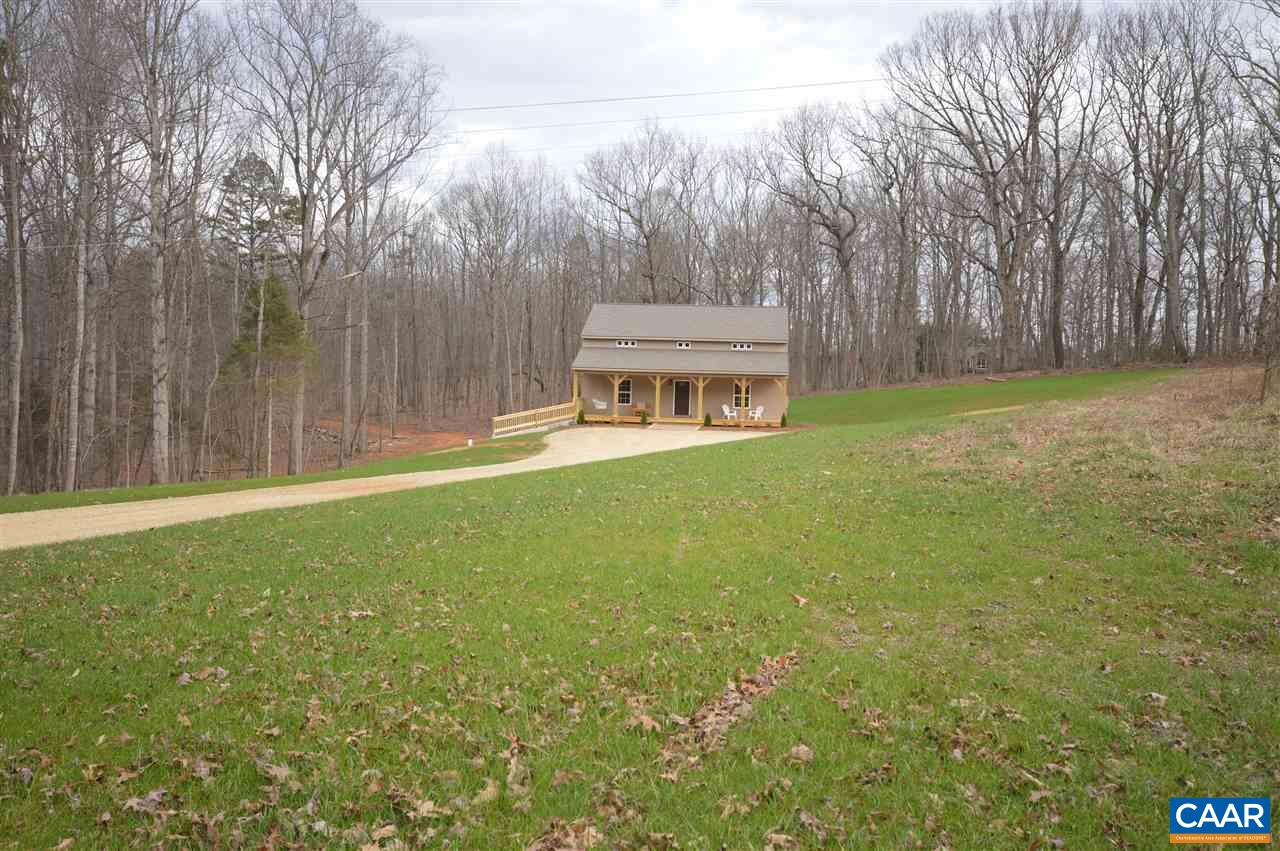 2501 Dunnes Shop Road Ruckersville, VA 22968 - Photo 32 of 46 a backyard of a house with lots of green space and fountain