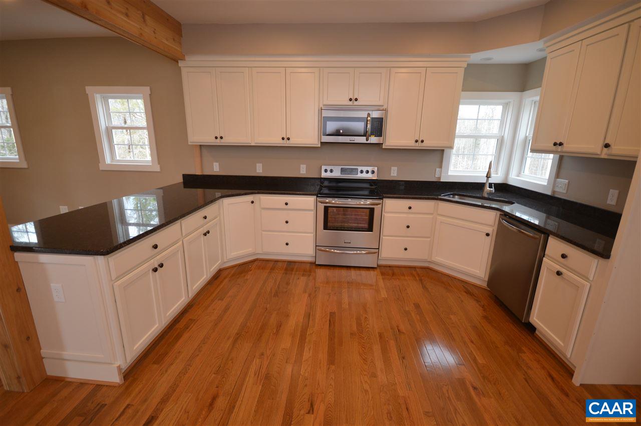 2501 Dunnes Shop Road Ruckersville, VA 22968 - Photo 8 of 46 a kitchen with granite countertop a sink cabinets and wooden floor
