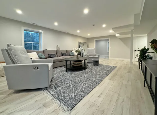 a living room with furniture and a table