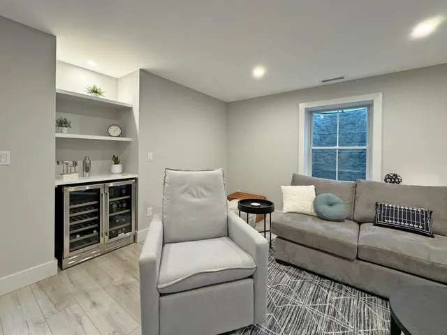 a living room with furniture and a window