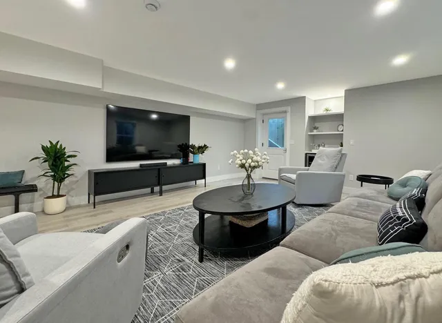 a living room with furniture and a flat screen tv