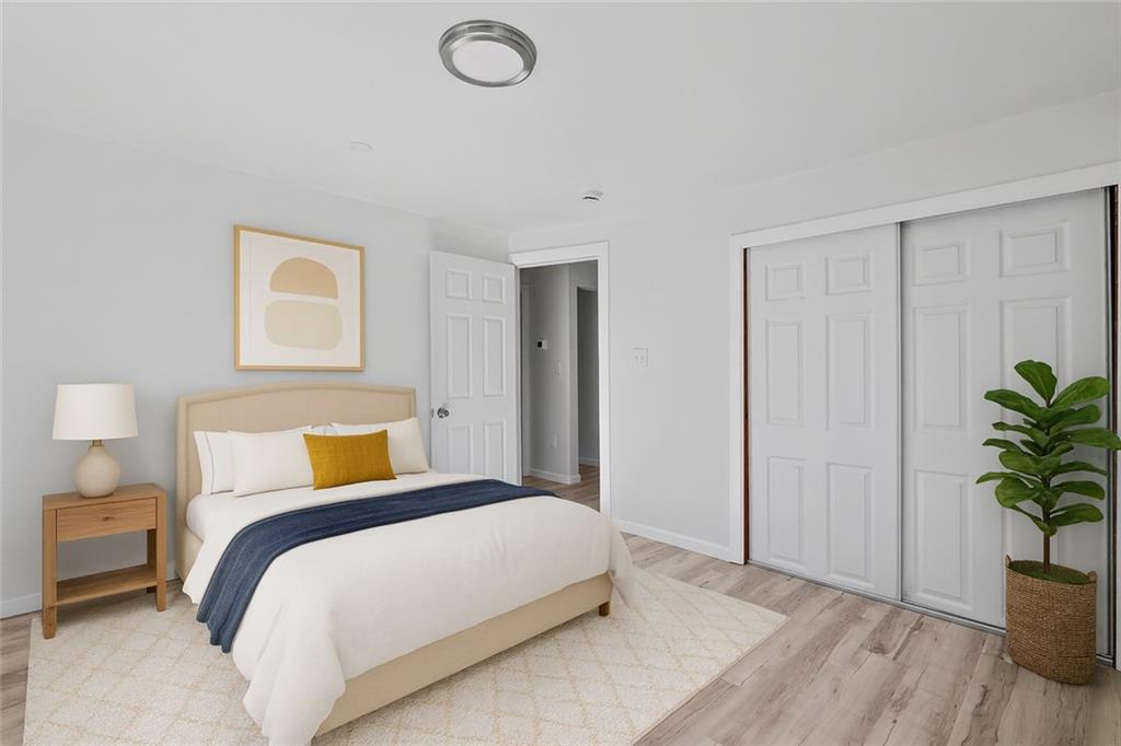 1460 Guffey Road Irwin, PA 15642 - Photo 13 of 33 a bedroom with a bed and a potted plant