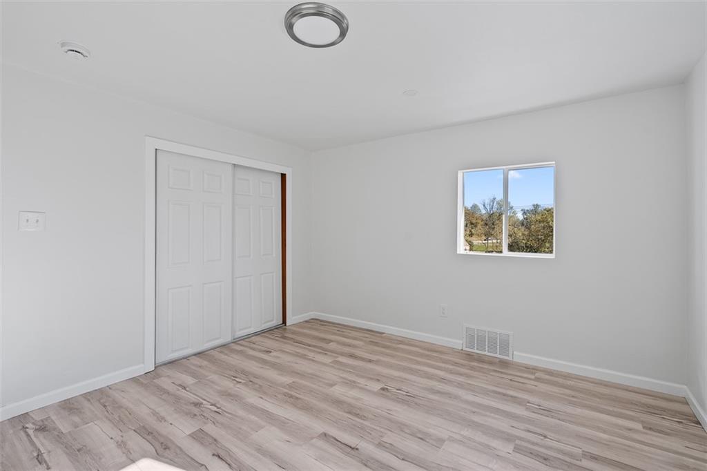 1460 Guffey Road Irwin, PA 15642 - Photo 14 of 33 a view of empty room with wooden floor