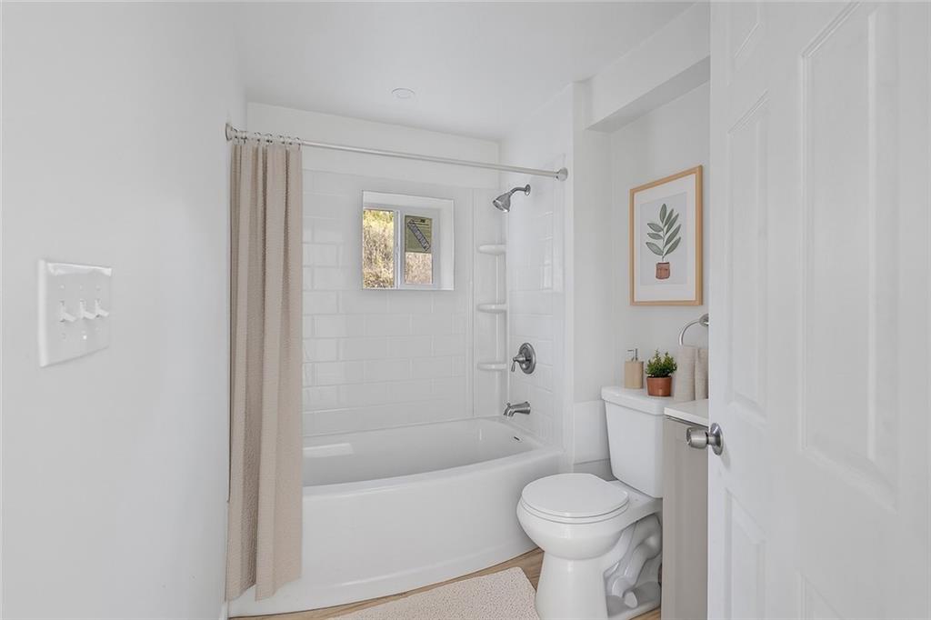 1460 Guffey Road Irwin, PA 15642 - Photo 15 of 33 a white toilet sitting next to a white tub