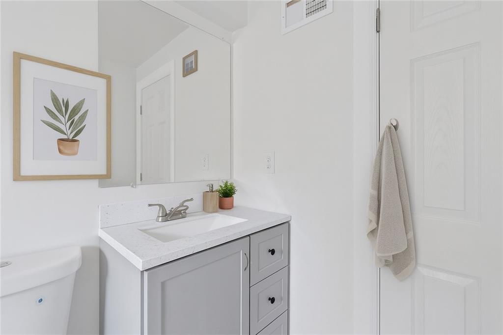 1460 Guffey Road Irwin, PA 15642 - Photo 16 of 33 a bathroom with a sink and a mirror