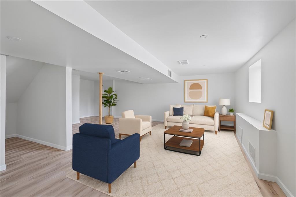 1460 Guffey Road Irwin, PA 15642 - Photo 20 of 33 a living room with furniture and wooden floor