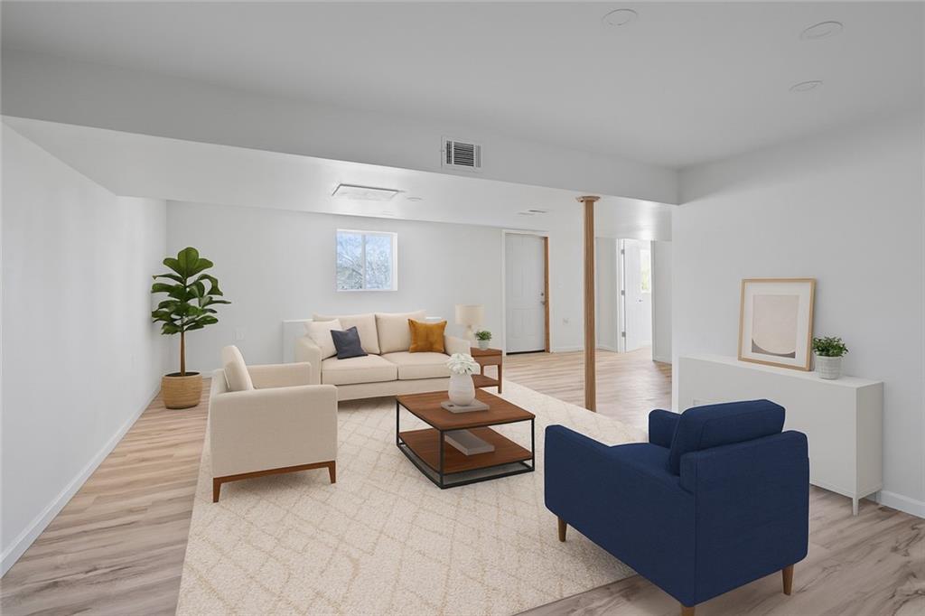 1460 Guffey Road Irwin, PA 15642 - Photo 21 of 33 a living room with furniture and a potted plant