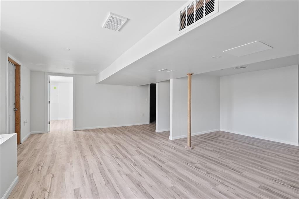 1460 Guffey Road Irwin, PA 15642 - Photo 23 of 33 a view of an empty room with wooden floor