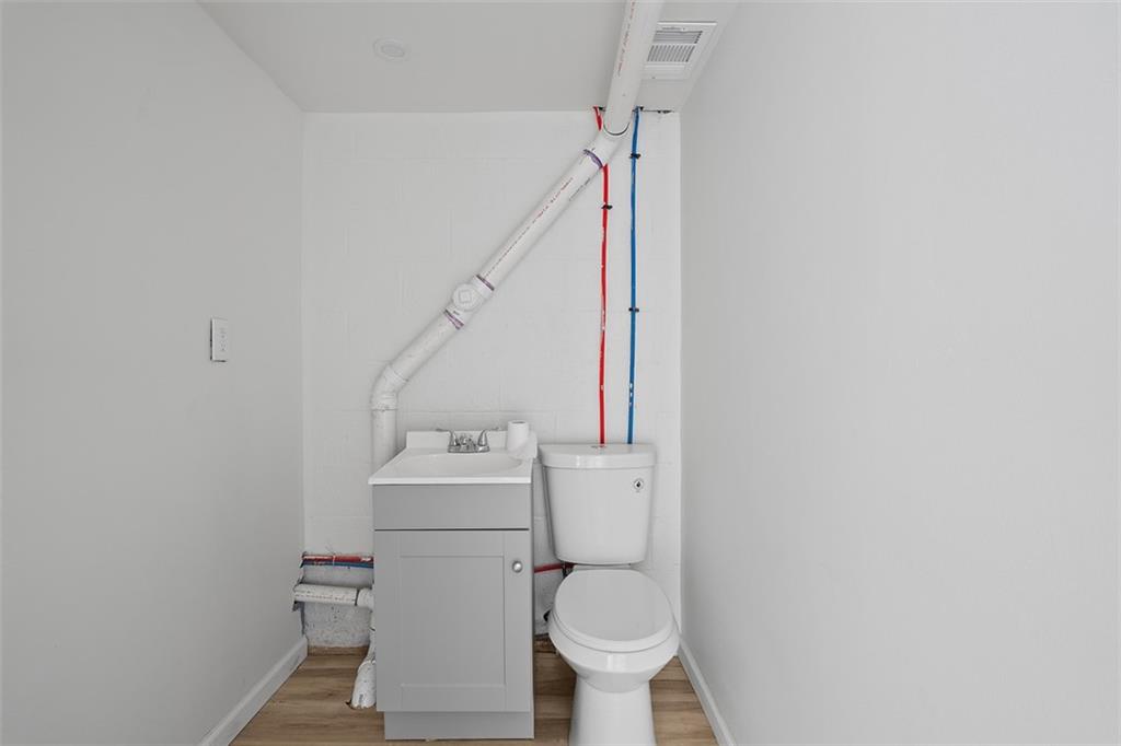1460 Guffey Road Irwin, PA 15642 - Photo 26 of 33 a bathroom with a sink toilet and a mirror