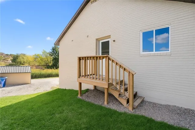 a view of a chair in backyard of the house