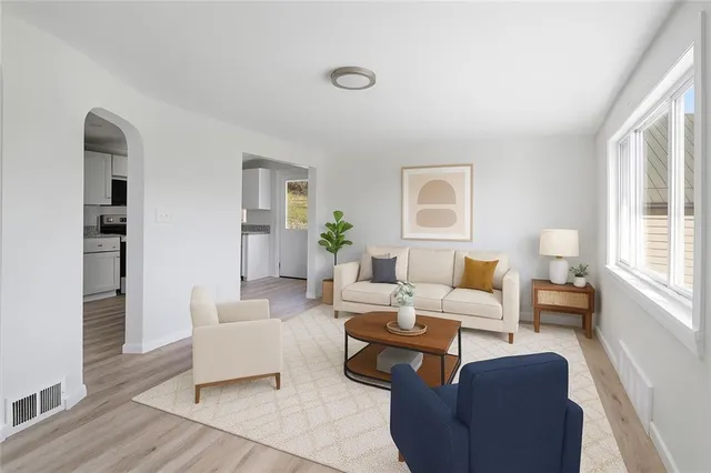 a living room with furniture and a window