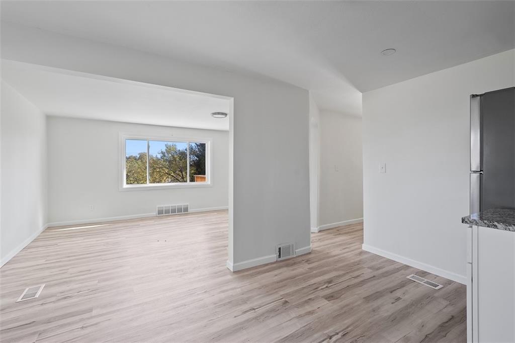 1460 Guffey Road Irwin, PA 15642 - Photo 7 of 33 wooden floor in an empty room